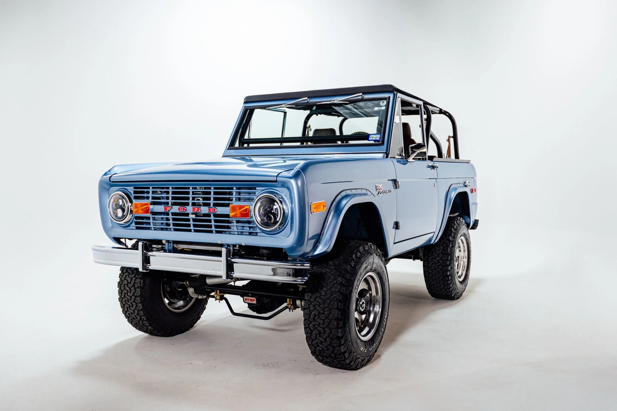 Frame-off restored Bronco shot in studio light by our crew
